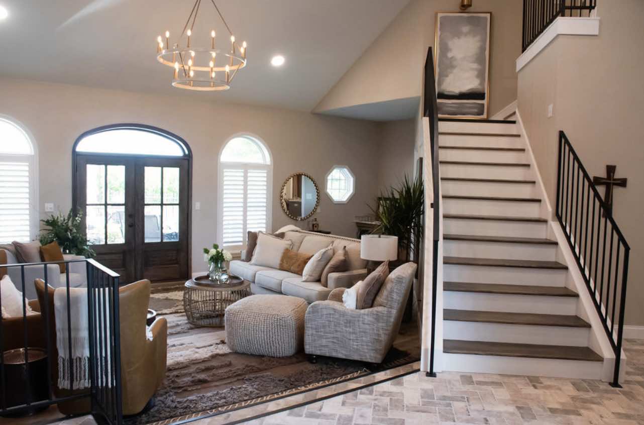 Timberline interior with warm light, seating area, and staircase