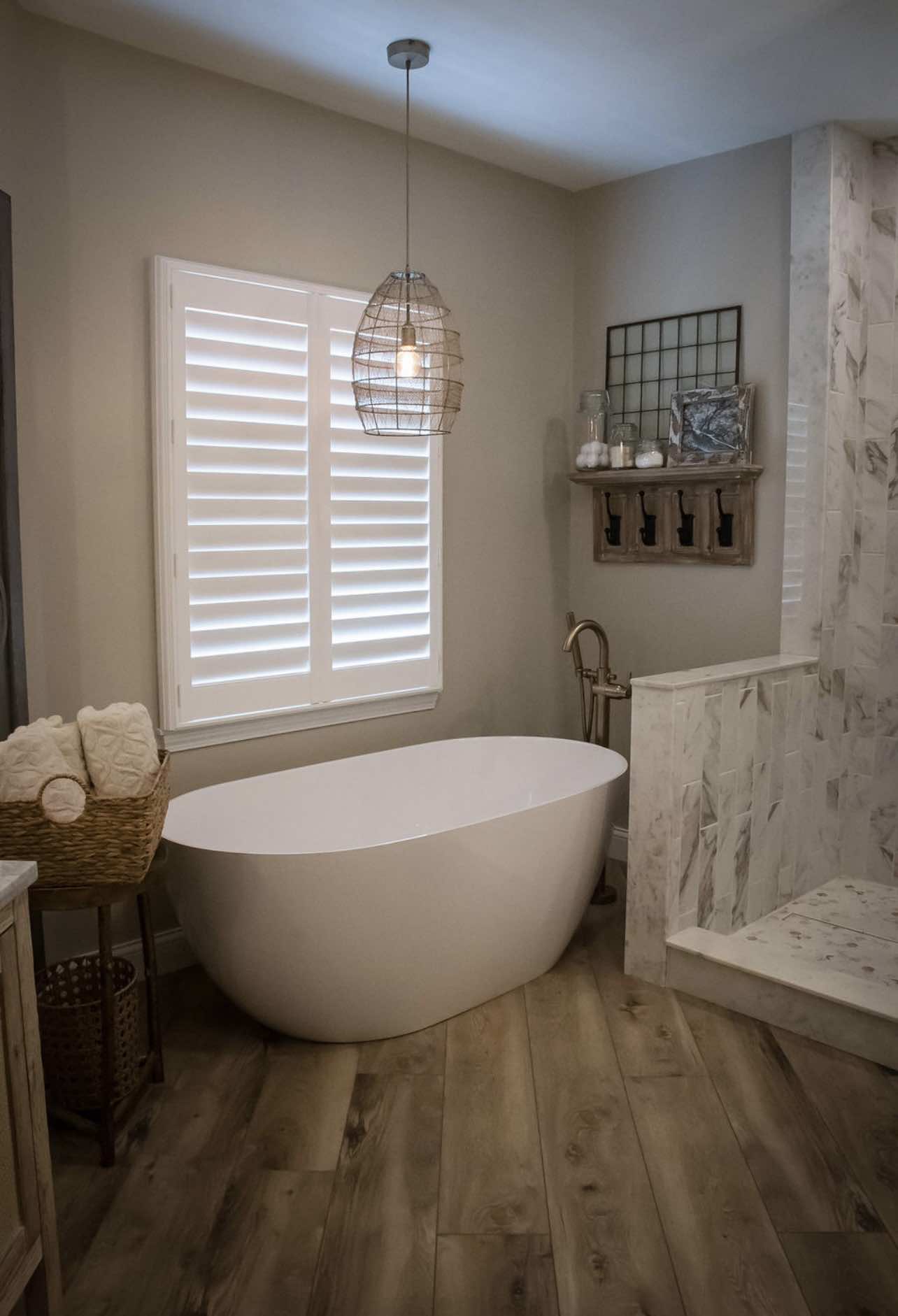 Freestanding tub and marble bath composition in a completed Timberline project